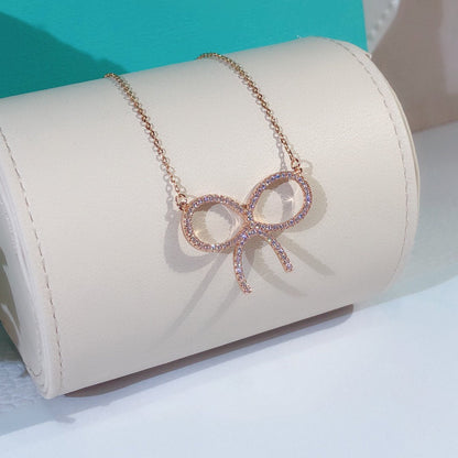 [Spark Jewels]CLAW SET RHODIUM PLATED BOW NECKLACE