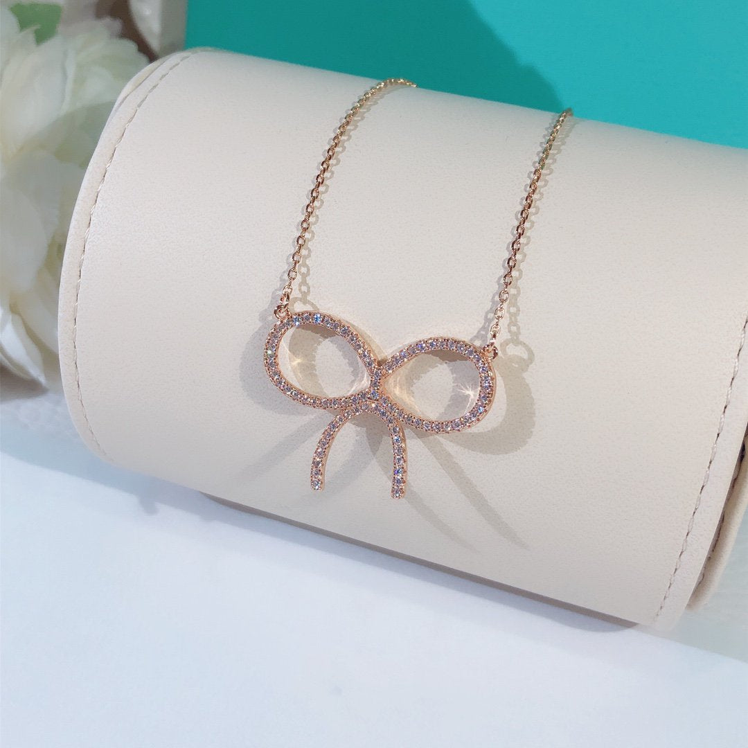 [Spark Jewels]CLAW SET RHODIUM PLATED BOW NECKLACE