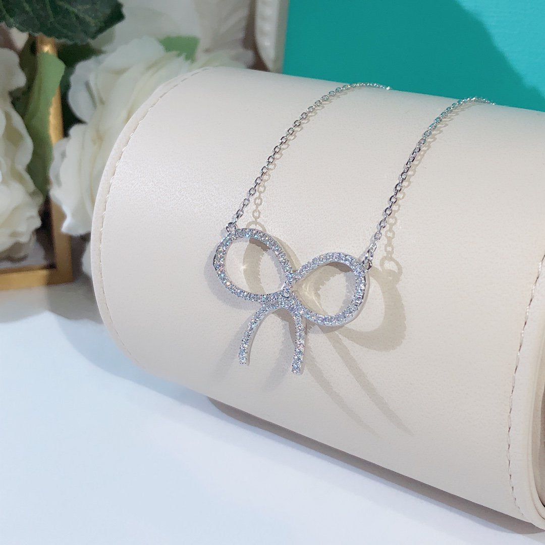 [Spark Jewels]CLAW SET RHODIUM PLATED BOW NECKLACE