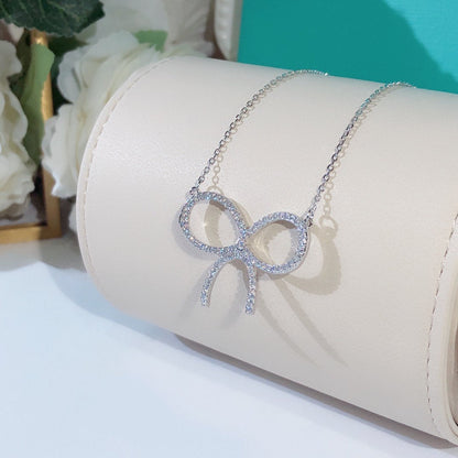 [Spark Jewels]CLAW SET RHODIUM PLATED BOW NECKLACE